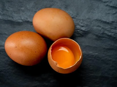Eggs on a red background Stock Photos