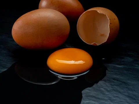 Eggs on a red background Stock Photos