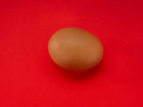 Eggs on a red background Stock Photos