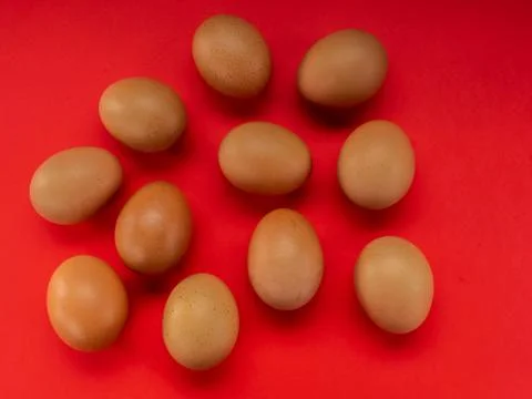 Eggs on a red background Stock Photos
