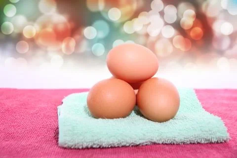 Eggs on red bokeh background. Stock Photos