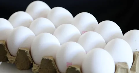 Eggs rotating at black background Stock-Footage 146746280