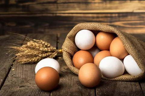 Eggs in sack Stock Photos
