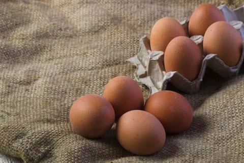Eggs on sackcloth background Foto stock