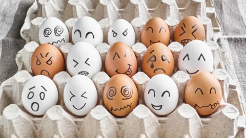 Eggs with sad and happy faces. Cute eggs with funny faces. Stop motion. Stock Footage 304551896