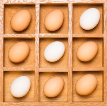 Eggs in shadow box diagonal Stock Photos