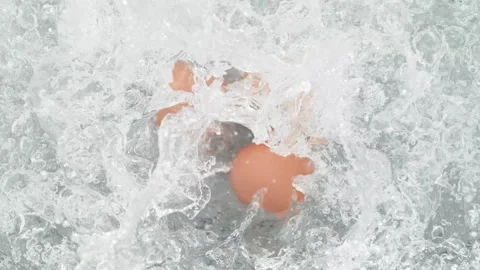 Eggs in Shells Falling into Pot of Boiling Water Stock Footage 271399287