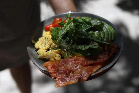 Eggs with spinach bacon and cherry tomato breakfast in mexico latin Foto stock