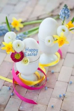 Eggs with spring flowers Stock Photos