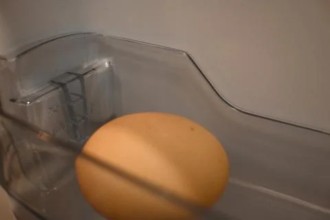 Eggs stored in refrigerator close-up kitchen food storage Stock Photos