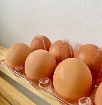 Eggs on the table close up Stock Photos