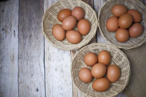 Eggs in three wicker baskets 写真素材