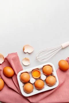 Eggs, towel in rustic style on light background. Organic ingredient, health.. Stock Photos