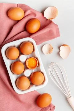Eggs, towel in rustic style on light background. Organic ingredient, health.. Stock Photos