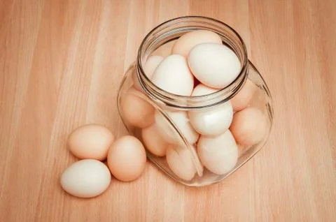 Eggs in a transparent can Stock Photos
