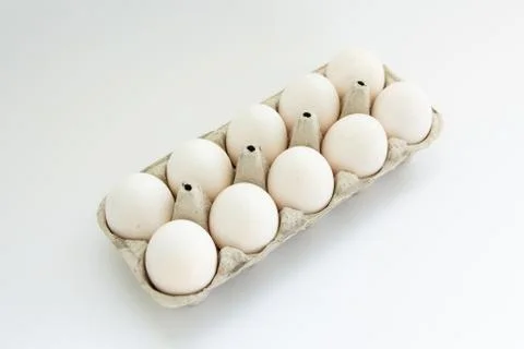 Eggs in a tray on a white background Foto stock