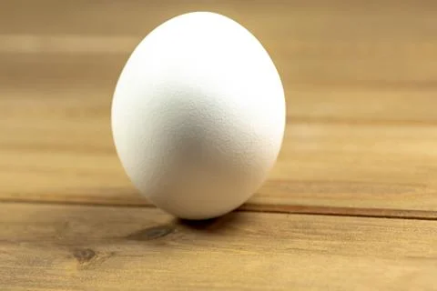 Eggs on a while plate sitting on the kitchen table waiting to be cracked Stock Photos