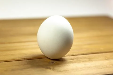 Eggs on a while plate sitting on the kitchen table waiting to be cracked Stock Photos