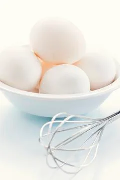 Eggs with whisk Stock Photos