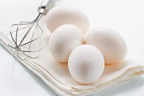Eggs with whisk Stock Photos