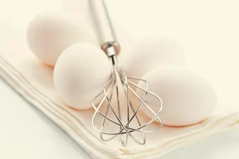 Eggs with whisk Stock Photos