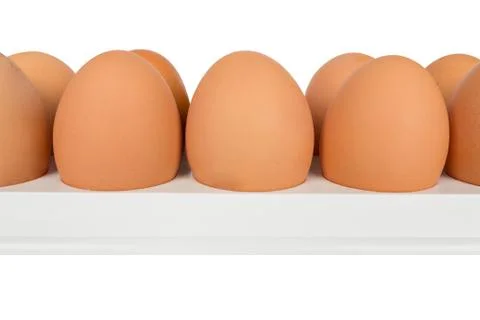 Eggs in white container Stock Photos