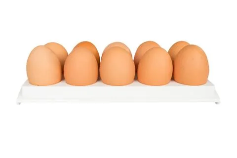 Eggs in white container Stock Photos