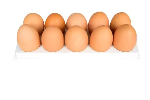 Eggs in white container Stock Photos
