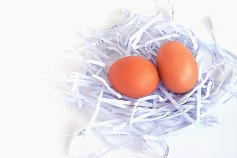 Eggs in a white nest Stock Photos
