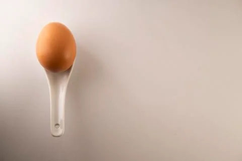Eggs in a white spoon Stock Photos