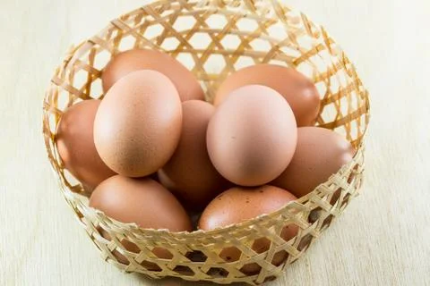 Eggs on wood background Stock Photos