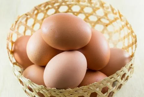 Eggs on wood background Stock Photos