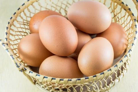 Eggs on wood background Stock Photos