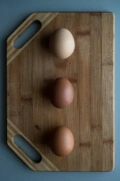 Eggs on the wood background Stock Photos
