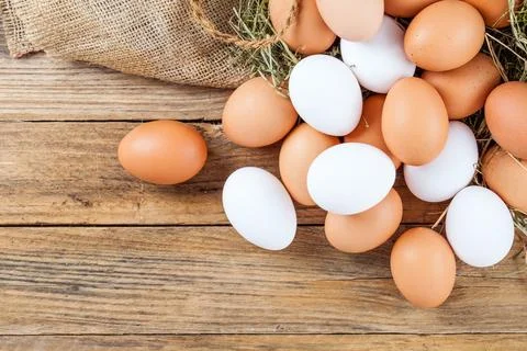 Eggs on wooden background Foto stock