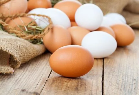 Eggs on wooden background Foto stock