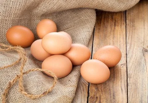 Eggs on wooden background Foto stock