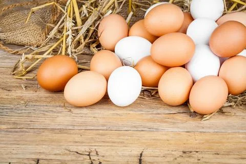 Eggs on wooden background Foto stock