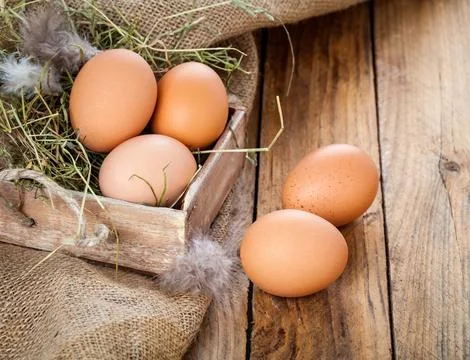 Eggs on wooden background Foto stock