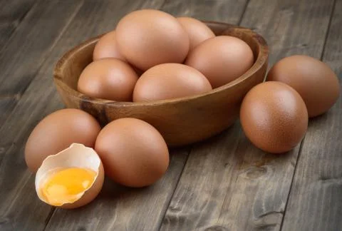 Eggs in a wooden bowl Stock Photos