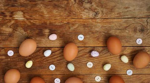 Eggs on a wooden rustic background with copy space for text. Stock Photos