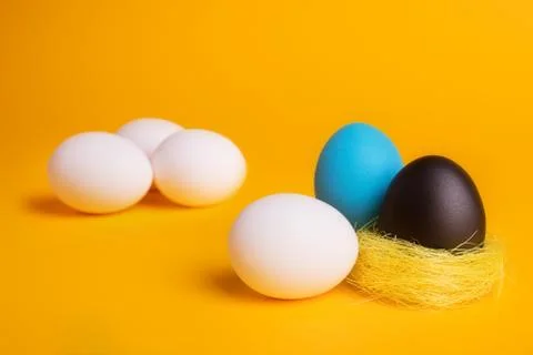 Eggs on a yellow background Stock Photos