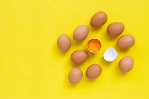 Eggs on yellow background. Stock Photos