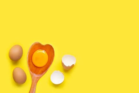 Eggs on yellow background. Stock Photos
