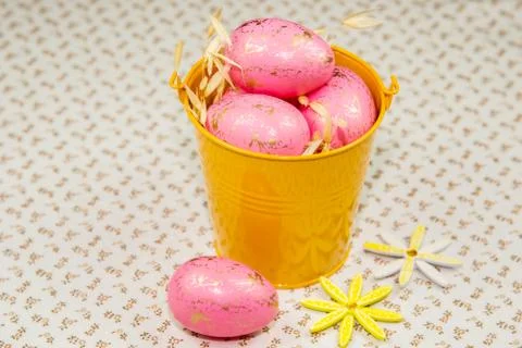 Eggs in yellow bucket Stock Photos