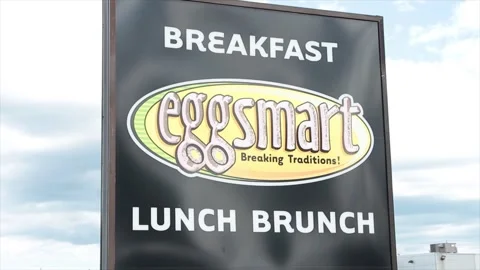 Eggsmart breaking traditions breakfast lunch brunch restaurant store square sign Stock-Footage 250282457