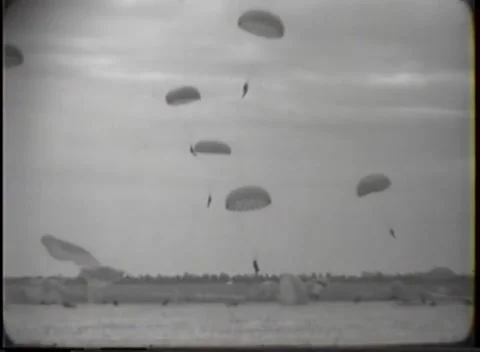 EGLIN FIELD, FLORIDA - 1948: Canopy descent — Parachutists approach the treeline Video stock 347314529
