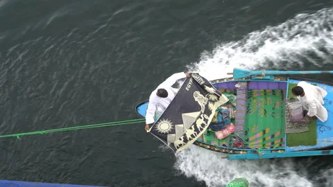 Egypt 22 Dec 2019 Tiny boats attaching to tourist cruise ships along the Nile Stock Footage 141315943