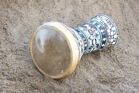 Egypt drum lying on the sand. Stock Photos