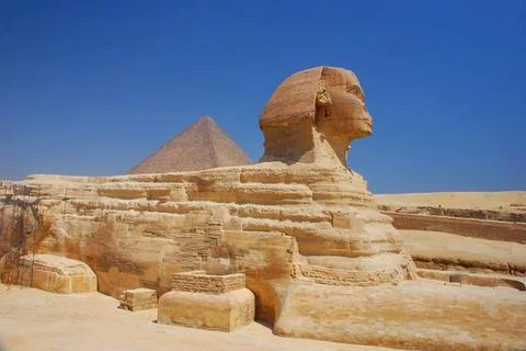 Egypt sphinx in full side view with blue sky egypt sphinx in full side vie... Stock Photos